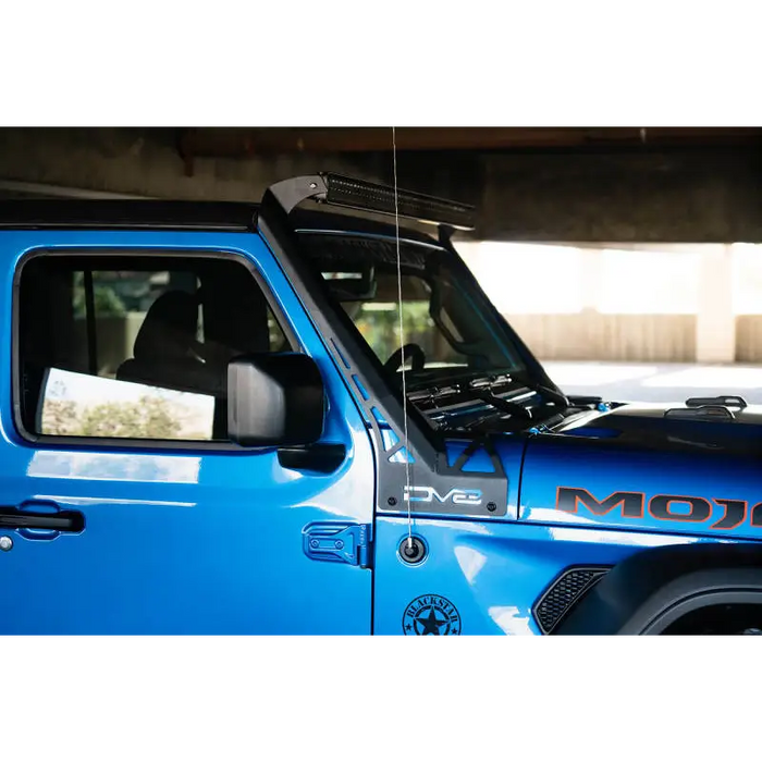 Blue Jeep with black roof rack featuring DV8 Offroad A-Pillar Light Bar Mount.