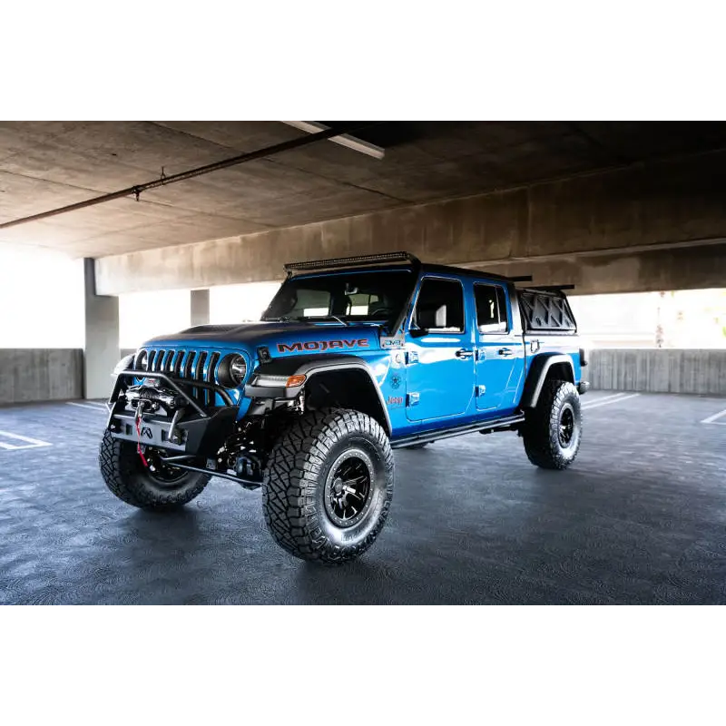 DV8 Offroad A-Pillar Light Bar Mount for Jeep JL 392 & JT Mojave parked in lot with blue paint job