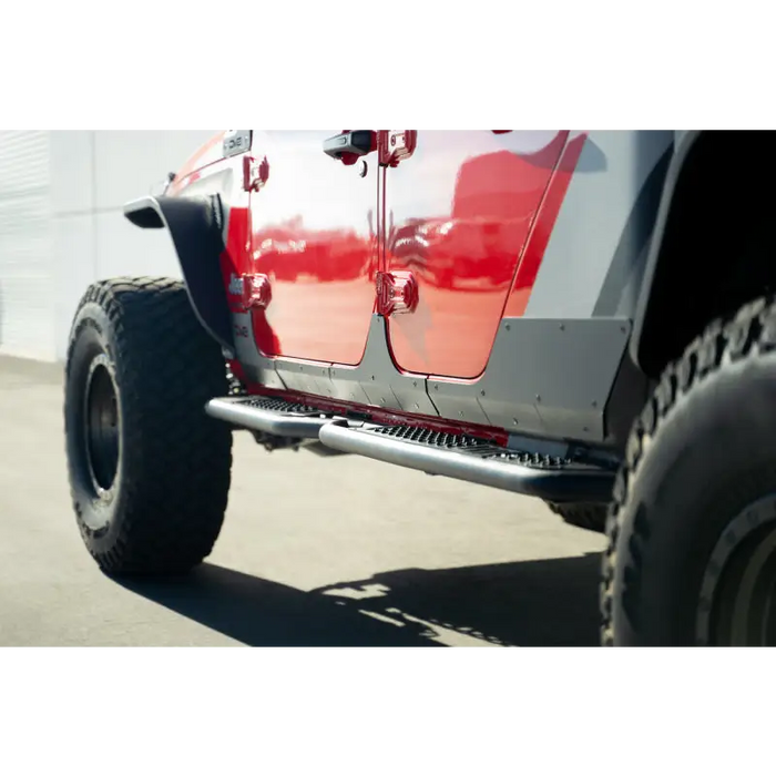 Red Jeep with Big Tire on Street - DV8 Offroad 20-23 Jeep Gladiator JT Rock Skins