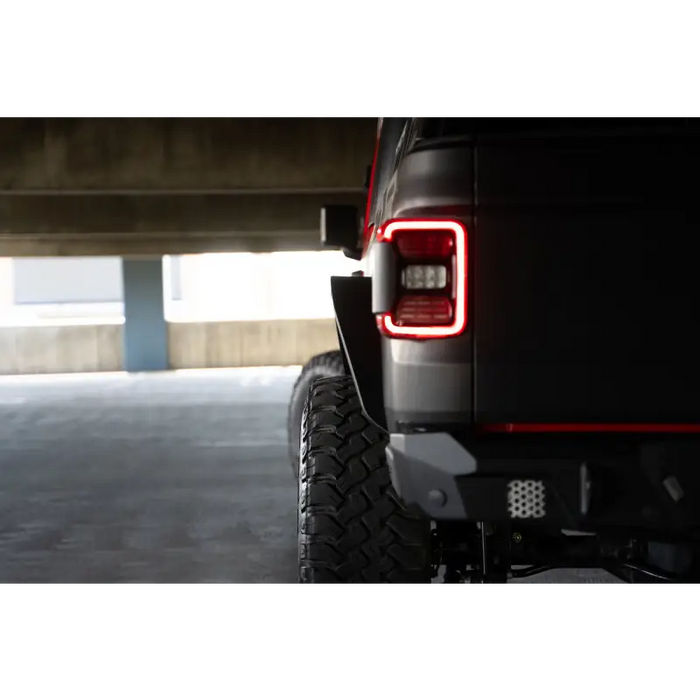 Black Jeep Gladiator JT with red LED lights and slim fender flares