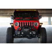 Red Jeep with yellow light on front from DV8 Offroad slim fender flares
