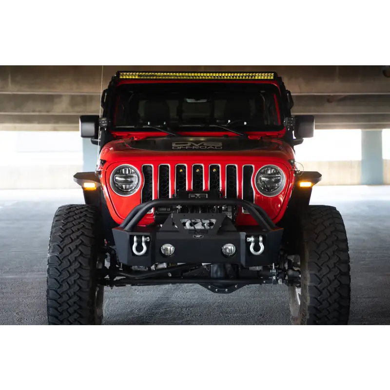 Red Jeep with yellow light on front from DV8 Offroad slim fender flares