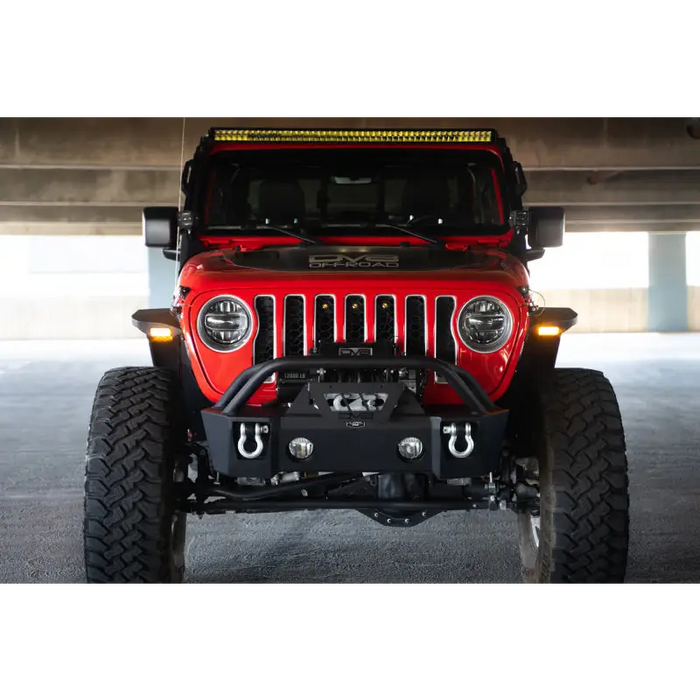 Red Jeep with yellow light on front from DV8 Offroad slim fender flares