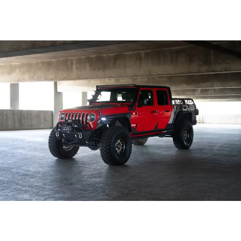 DV8 Offroad 20-23 Jeep Gladiator JT Slim Fender Flares in red Jeep parked under bridge in parking garage