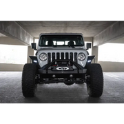 Close up of Jeep parked in garage with DV8 Offroad 20-23 Jeep Gladiator JT Spec Series Fender Flares
