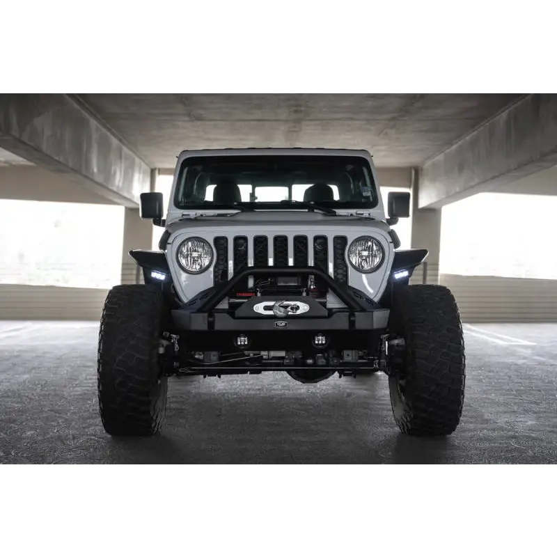 Close up of Jeep parked in garage with DV8 Offroad 20-23 Jeep Gladiator JT Spec Series Fender Flares