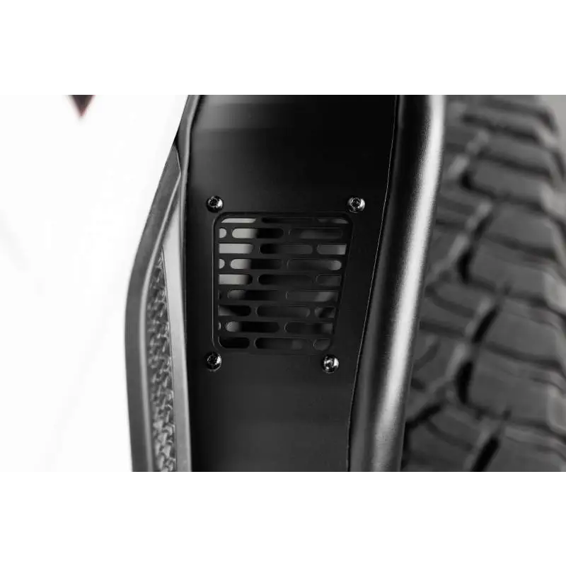 Close up of DV8 Offroad 20-23 Jeep Gladiator JT Spec Series Fender Flares bumper plate.