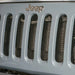 DV8 Offroad Jeep JK Black Mesh Grille displayed on blue Jeep Wrangler