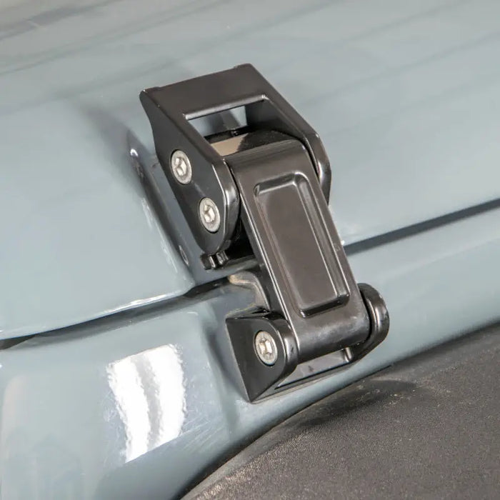 Close up of car door latch in DV8 Offroad Jeep Rocklaw Hood Catch System