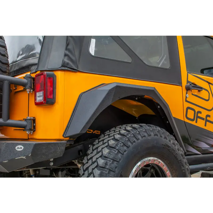 Rear bumper mounted on DV8 Offroad 2007-2018 Jeep Wrangler armor style fenders.