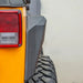 DV8 Offroad 2007-2018 Jeep Wrangler Armor Style Fenders: Rear view of yellow jeep with red tail light.
