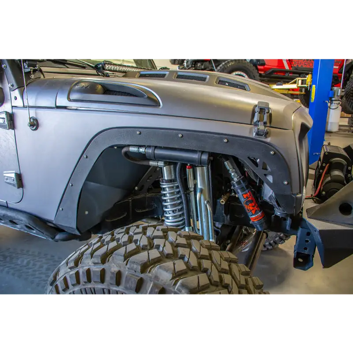 DV8 Offroad Jeep Wrangler Fender Delete Kit with Big Tire in Garage