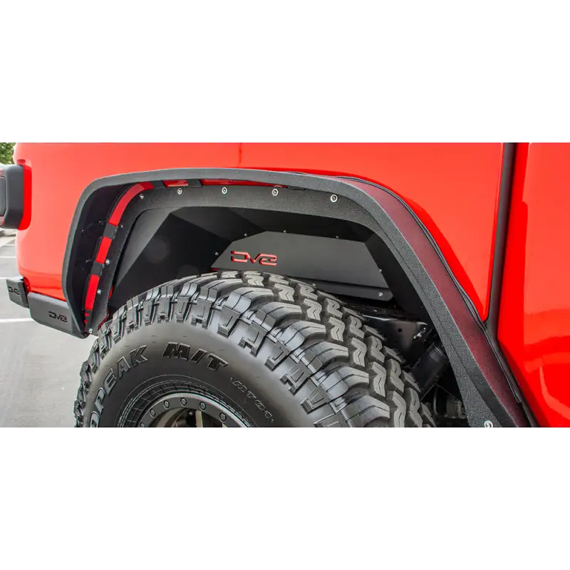 Red truck with tire on side - DV8 Offroad Gladiator Rear Inner Fenders Eco-friendly alternative materials.