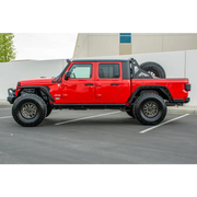 Red Jeep Gladiator with black bumper and wheels by DV8 Offroad.