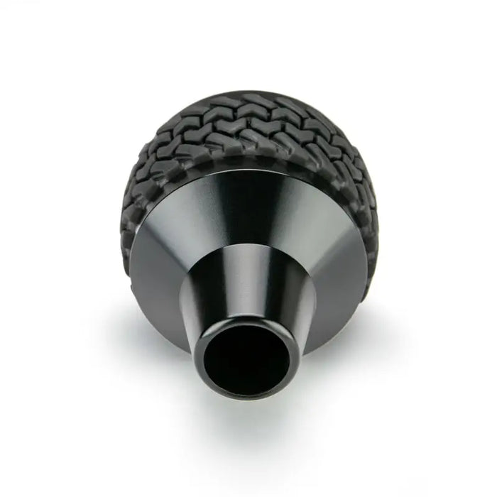 DV8 Offroad black tire shift knob for Jeep Wrangler on white background