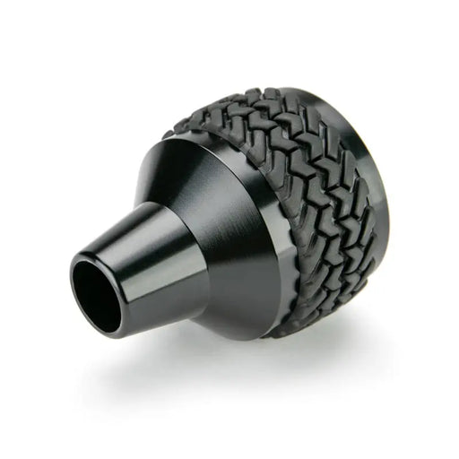 Black plastic shift knob with braid pattern for Jeep Wrangler.