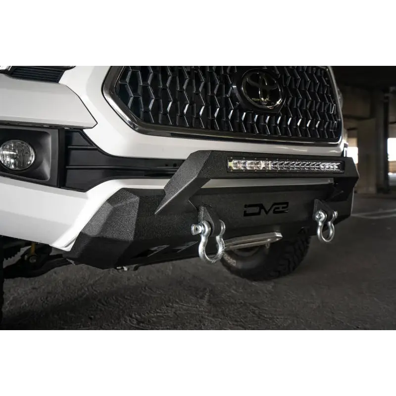 DV8 Offroad Toyota Tacoma Center Bumper with White Ford Ranger Front Bumper Close Up
