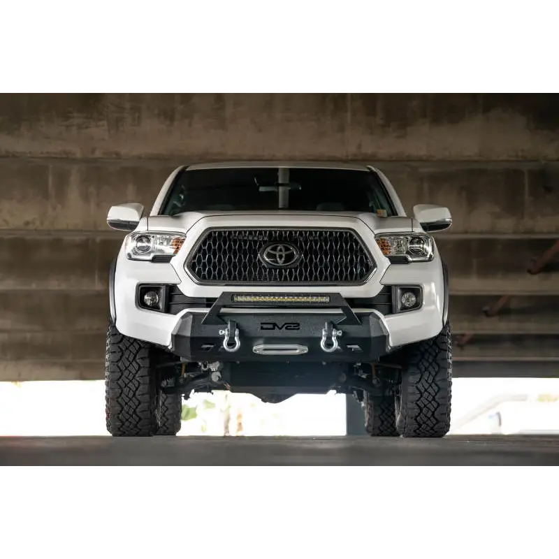 White Toyota Tacoma truck parked in garage - DV8 Offroad 2016+ Toyota Tacoma Center Bumper