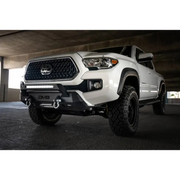 DV8 Offroad Toyota Tacoma Center Bumper with white truck front end