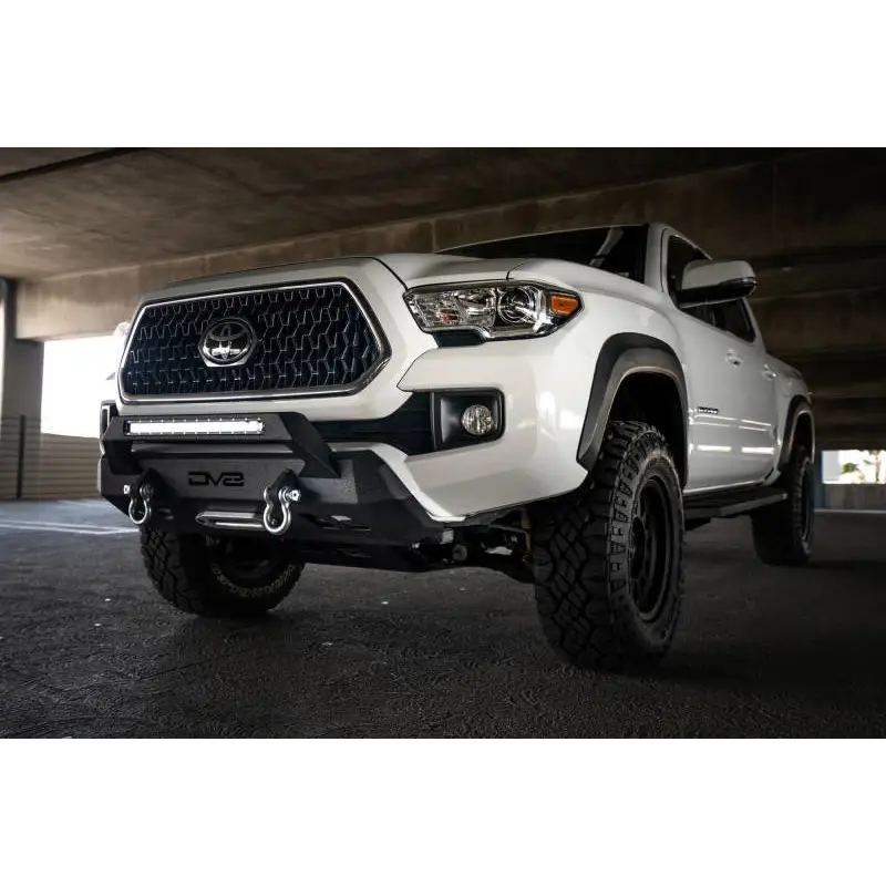 DV8 Offroad Toyota Tacoma Center Bumper with white truck front end