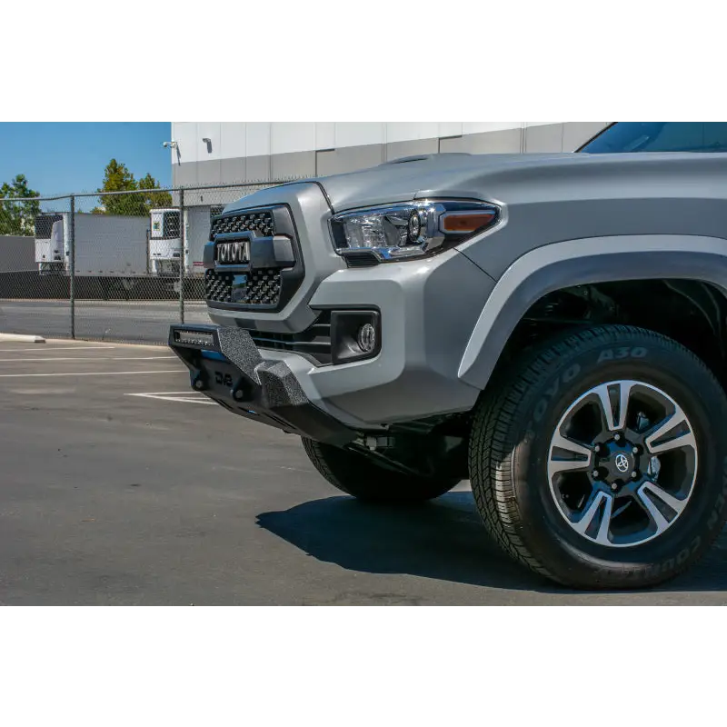 Silver Toyota Tacoma truck front end on DV8 Offroad 2016+ Toyota Tacoma Center Bumper.
