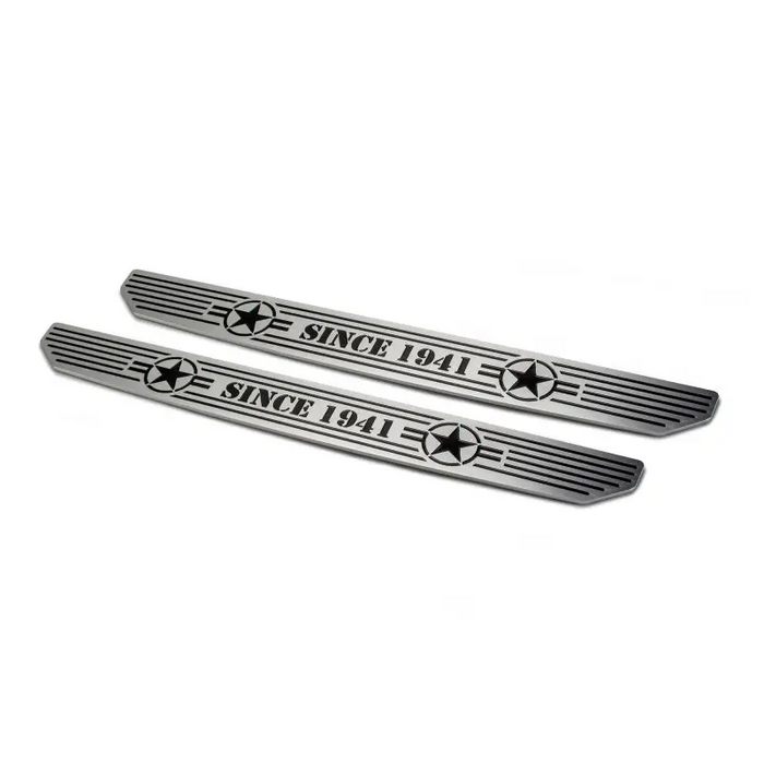 Pair of chrome front bumper emblems for Mercedes displayed on black anodized accent bars - Jeep Gladiator.