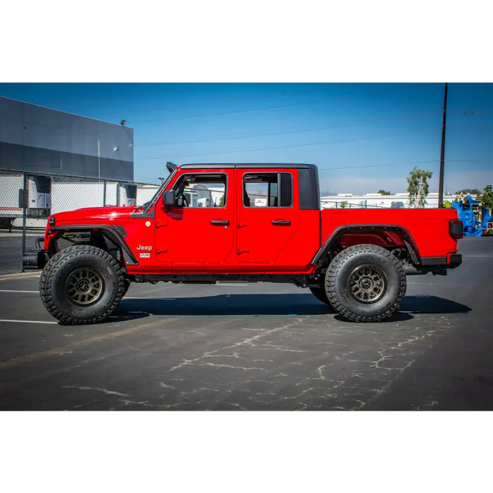 Red Jeep with black rim and wheels on DV8 Offroad 2018+ Jeep Gladiator Rear Bumper