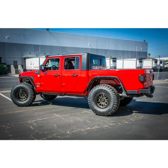 Red DV8 Offroad Jeep Gladiator Rear Bumper with Black Top and Tires