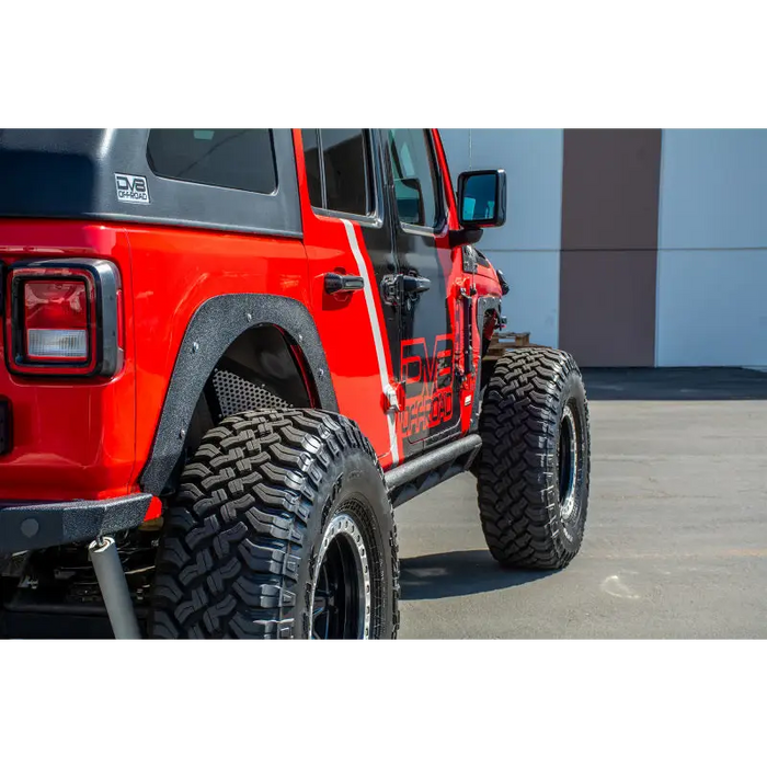 DV8 Offroad 2018+ Jeep JL Fender Delete Kit with red jeep and big tire parked in lot
