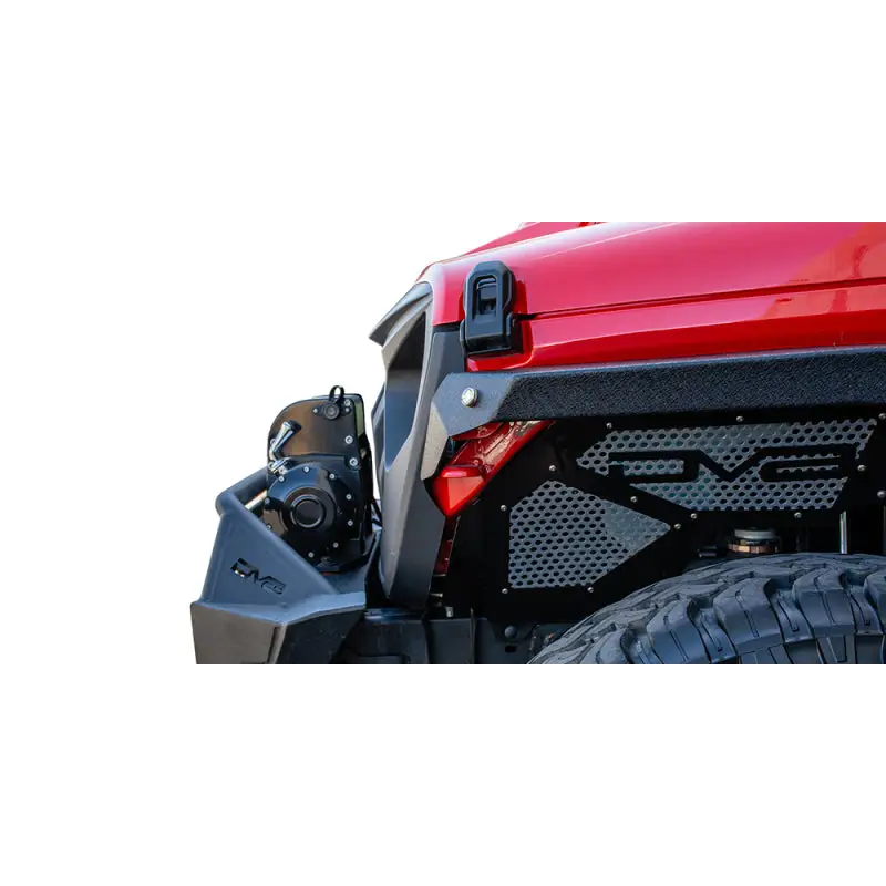 Red jeep with DV8 Offroad Angry Grill shown with a black bumper and tire.