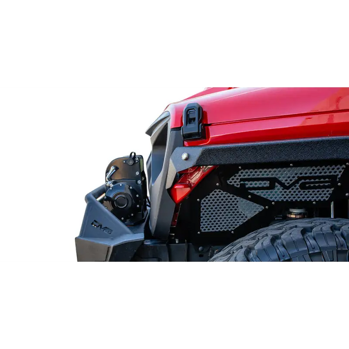 Red jeep with DV8 Offroad Angry Grill shown with a black bumper and tire.