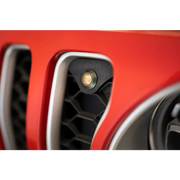 Red car front end with yellow light - DV8 Offroad Jeep JL Grill Amber Marker Lights