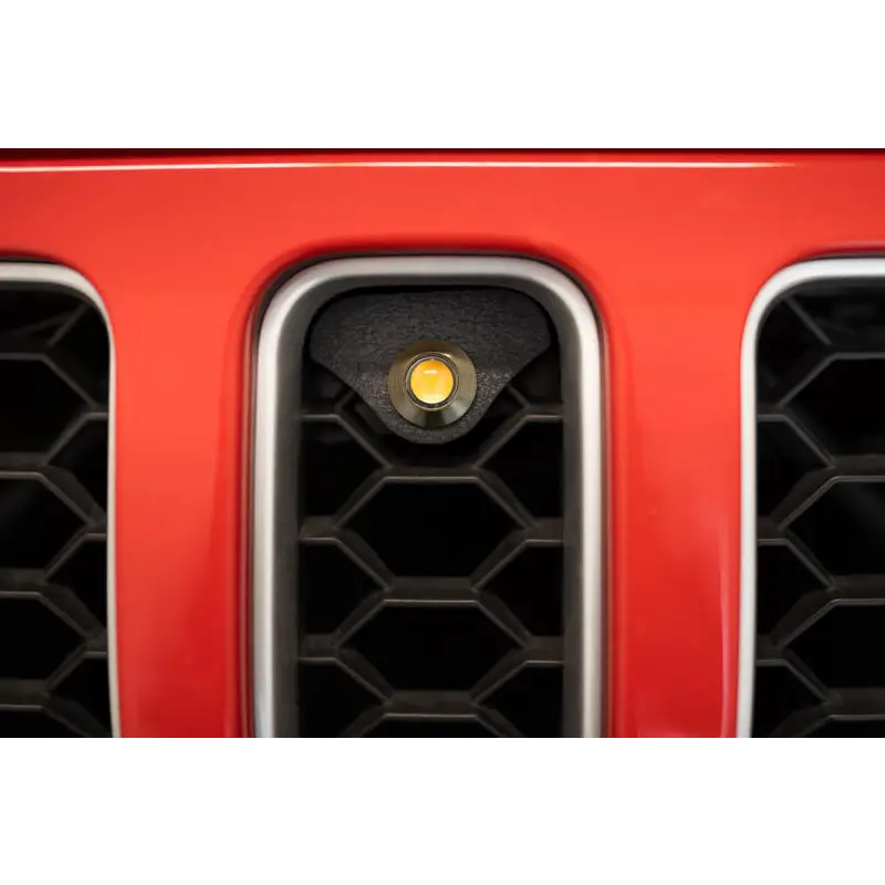 Red car front bumper plate on DV8 Offroad 2018+ Jeep JL Grill Amber Marker Lights.