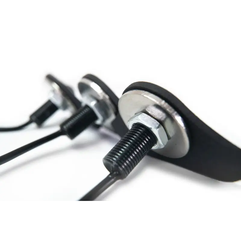 Black earphones with metal handle on DV8 Offroad Jeep JL grill amber marker lights.