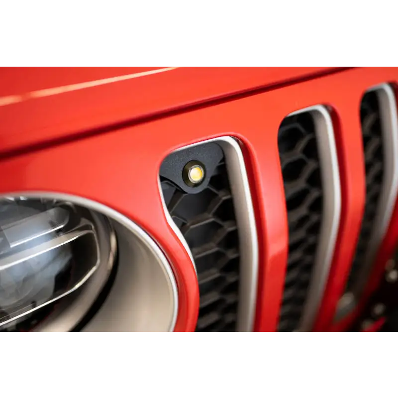 Red Jeep JL grill with black grill and amber marker lights