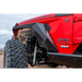 Red Jeep with large tire, DV8 Offroad 2018+ Wrangler JL Armor Fenders with LED Turn Signal Lights