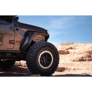 Black DV8 Offroad 2018+ Jeep Wrangler JL Front Inner Fenders parked in desert