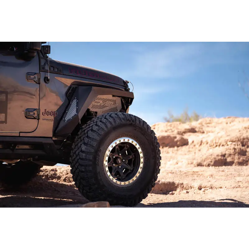 Black DV8 Offroad 2018+ Jeep Wrangler JL Front Inner Fenders parked in desert