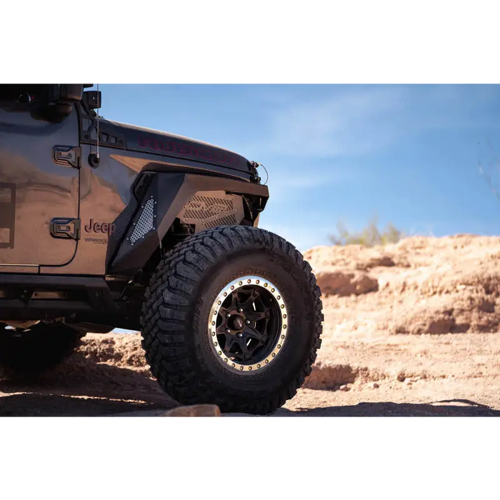 Black DV8 Offroad 2018+ Jeep Wrangler JL Front Inner Fenders parked in desert