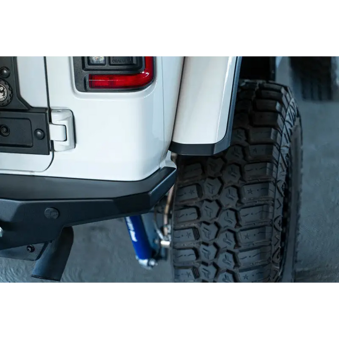 White truck with black and blue bumper, DV8 Offroad 2018 Jeep Wrangler JL FS-15 Series Rear Bumper