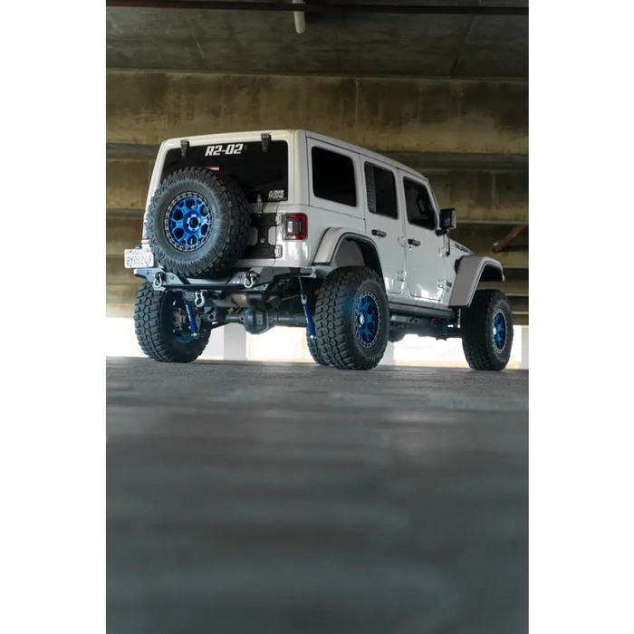 DV8 Offroad 2018 Jeep Wrangler JL FS-15 Series Rear Bumper with white jeep and blue wheels