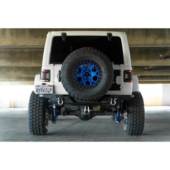 White Jeep Wrangler with Blue Wheels and Tires on DV8 Offroad 2018 JL FS-15 Series Rear Bumper