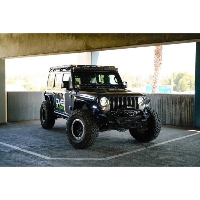 DV8 Offroad 2018+ Jeep Wrangler JL Light Bar Mount with Roof Rack-ready Jeep parked in lot