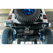 DV8 Offroad 2018 Jeep Wrangler JL MTO Series rear bumper with blue tire on white jeep