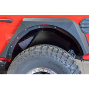 Red Jeep Wrangler with Black Bumper and Tire Cover by DV8 Offroad.