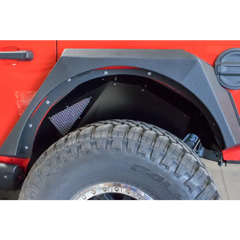 Red Jeep Wrangler with Black Bumper and Tire Cover by DV8 Offroad.