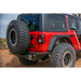 Red jeep with black tire on DV8 Offroad 2018+ Jeep Wrangler JL tailgate mounted tire carrier