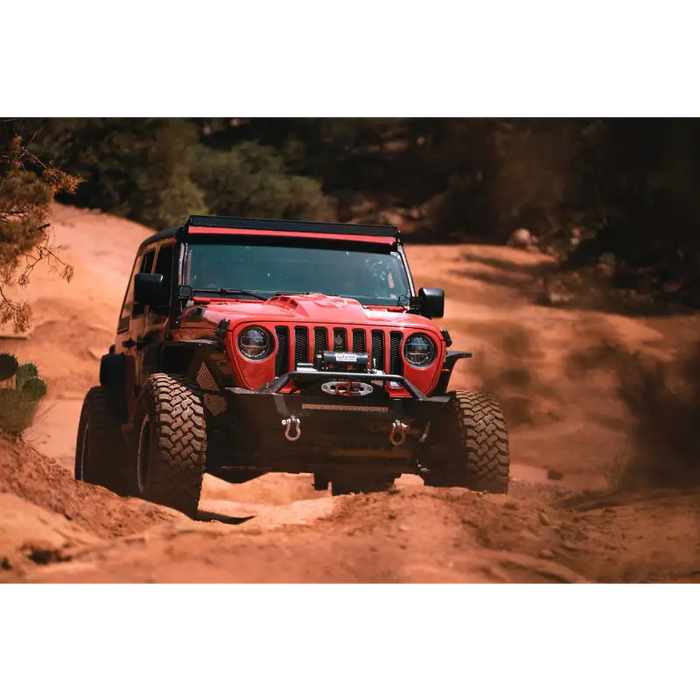 Red Jeep driving on dirt road - DV8 Offroad Wrangler JL Gladiator LED Projector Headlights