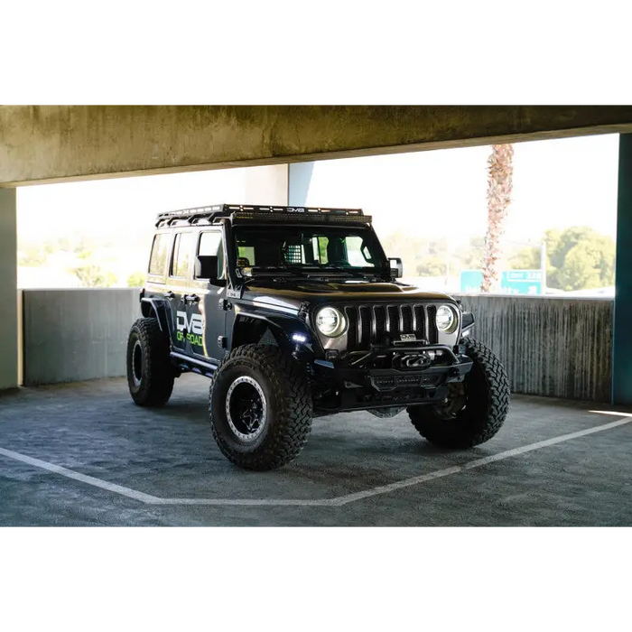 DV8 Offroad 2018+ Jeep Wrangler JLO A Pillar Dual Light Pod Mounts with Roof Rack parked in lot