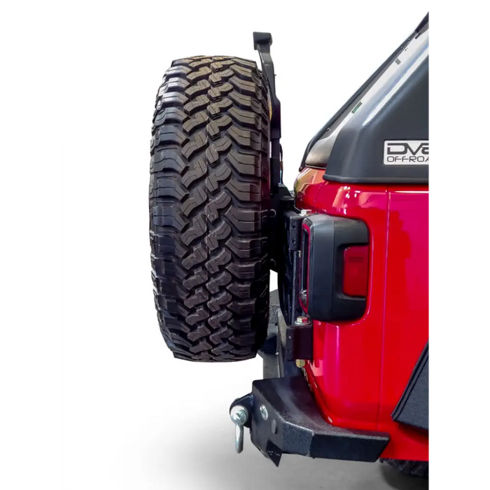 DV8 Offroad 2018+ Jeep Wrangler tire carrier with front bumper mount installed
